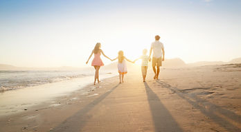 Family walking on the beach